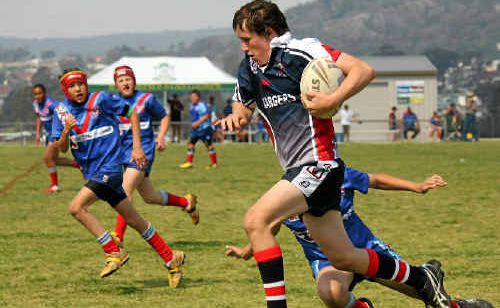 Warwick and District player Lachlan Hendry makes a break through the defensive line. 
